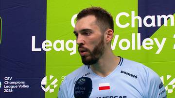Jurij Semeniuk, siatkarz, udziela wywiadu na tle niebiesko-zielonej ściany z logo CEV Champions League Volley 2026.