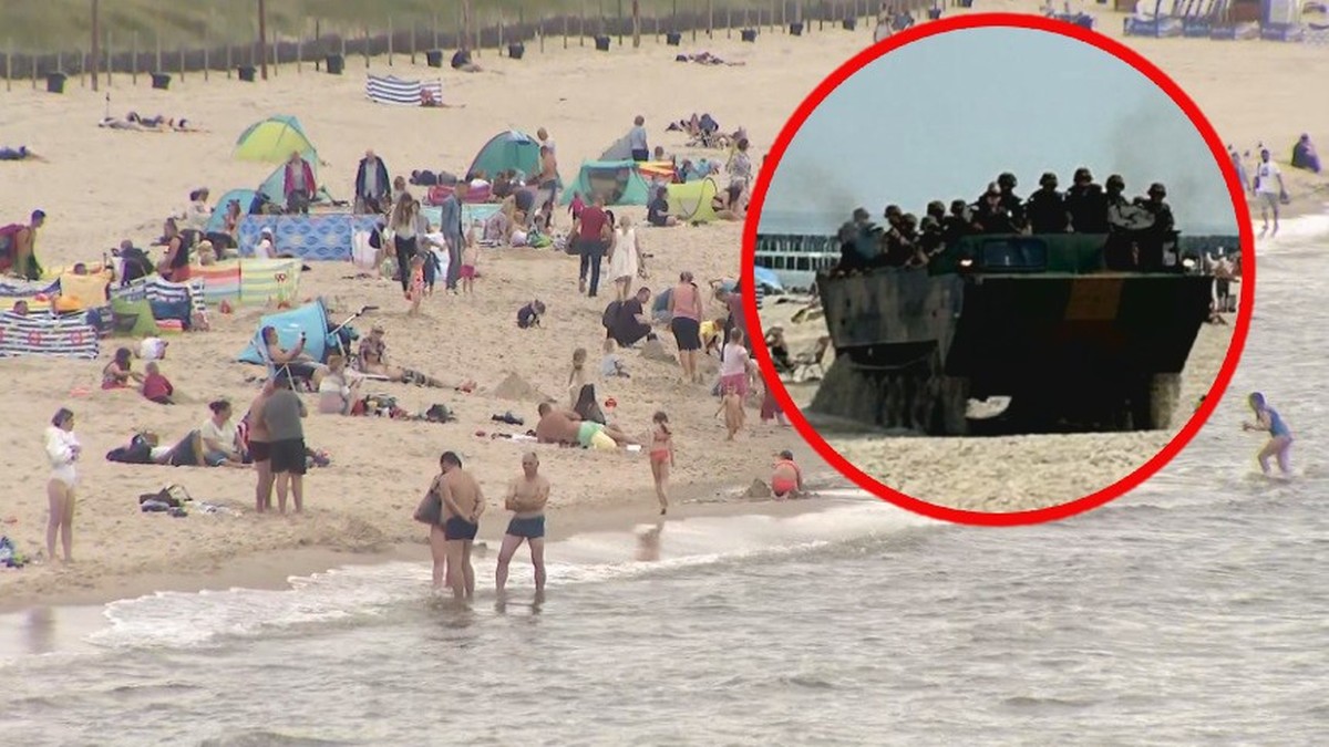 Niecodzienny widok na plaży. Wojskowe transportery między parawanami