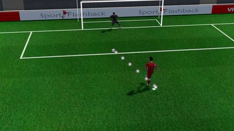 Symulacja rzutu karnego w meczu piłki nożnej, zawodnik biegnie do piłki przed bramkarzem.