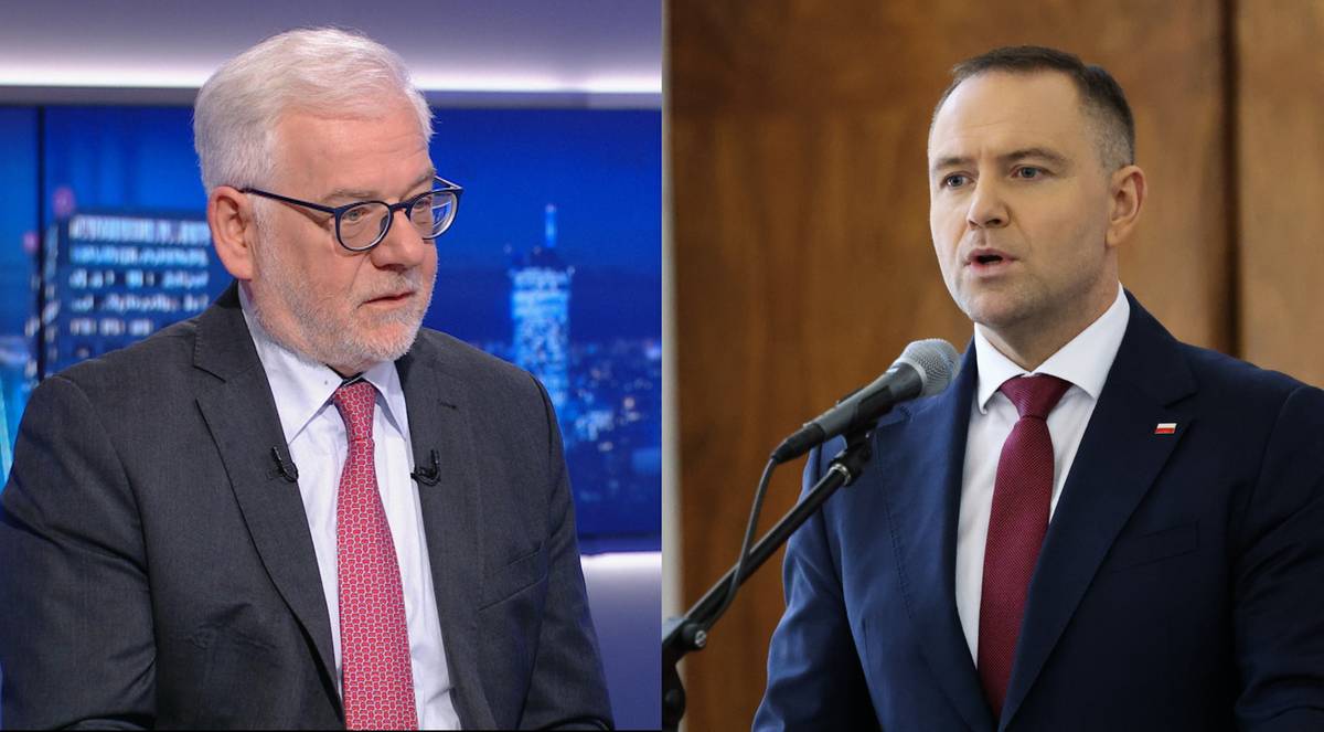 Dwóch mężczyzn w garniturach podczas dyskusji politycznej.