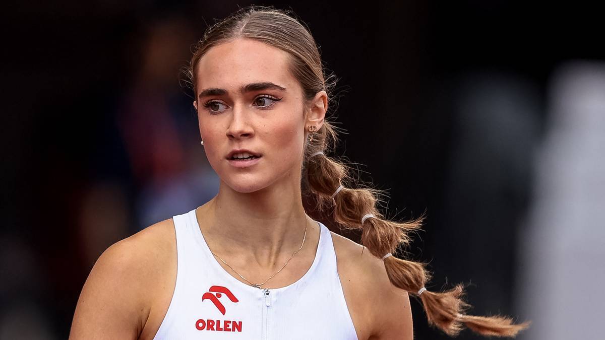 Młoda lekkoatletka w stroju sportowym z widocznym logo ORLEN.