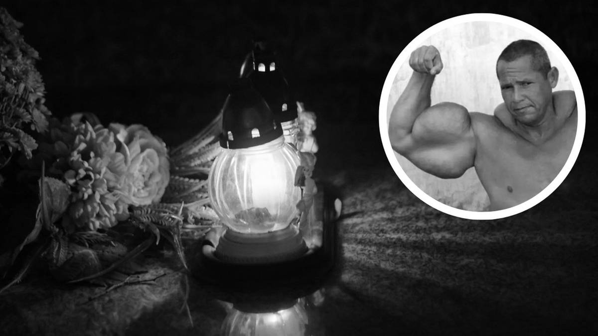 Zdjęcie przedstawia znicz z płomieniem i kwiaty po lewej stronie, oraz okrągłe zdjęcie umięśnionego mężczyzny po prawej stronie.