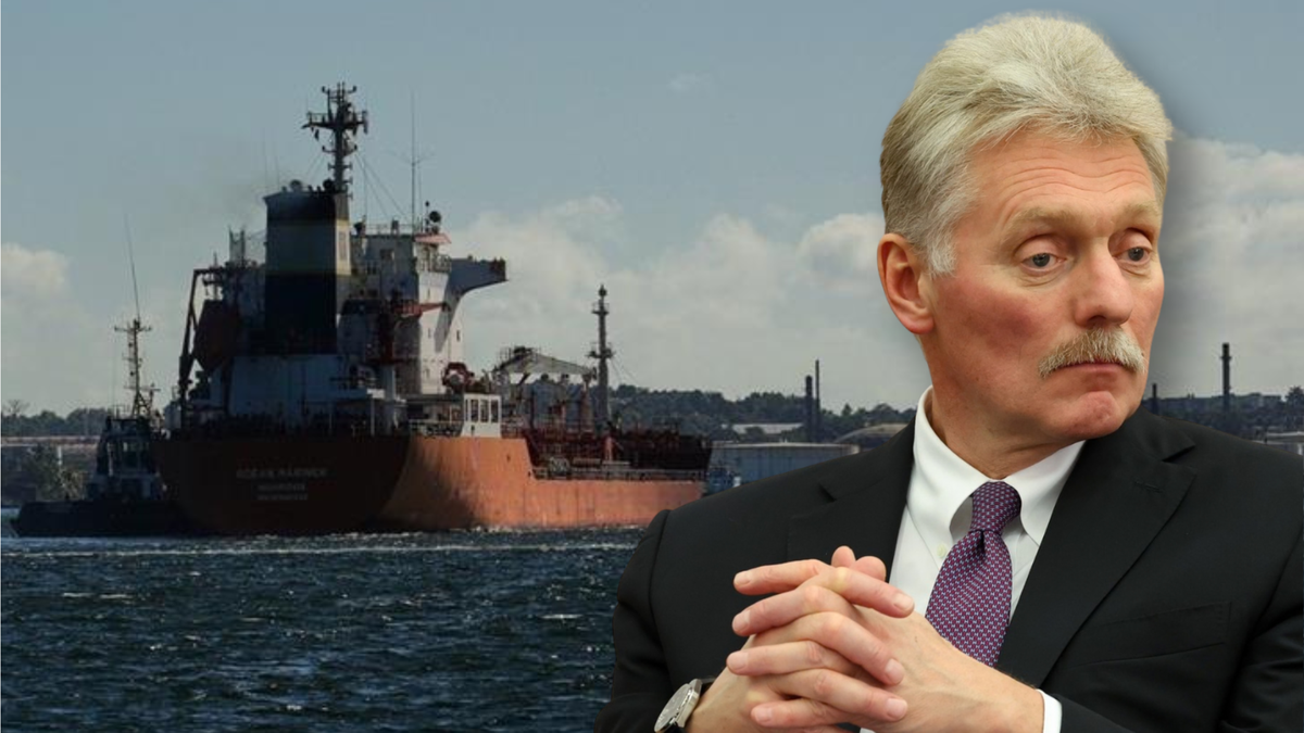 Mężczyzna w garniturze i statek towarowy.