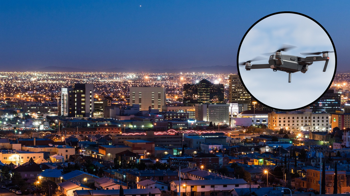 Widok panoramy miasta nocą z widocznym w okręgu dronem w locie.